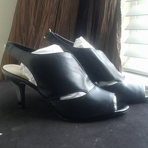 Black leather pumps